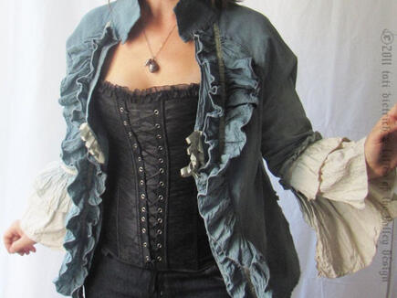 A corset and ruffled jacket ensemble