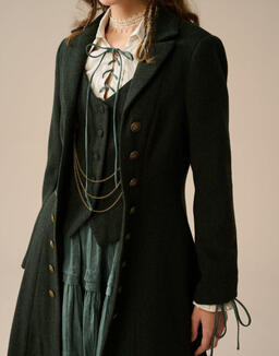 A waistcoat and jacket ensemble in deep green