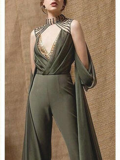 A soft green pantsuit with a deep V neckline